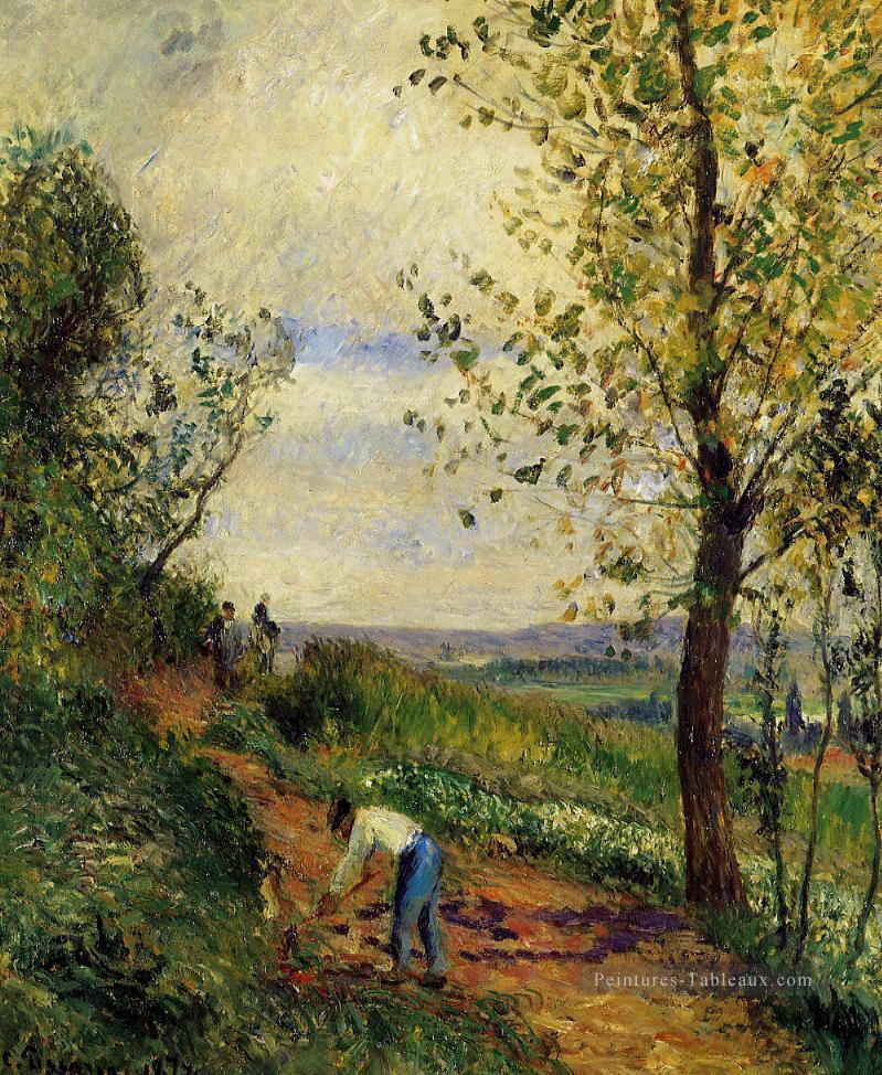 paysage avec un homme qui creuse 1877 Camille Pissarro Peintures à l'huile